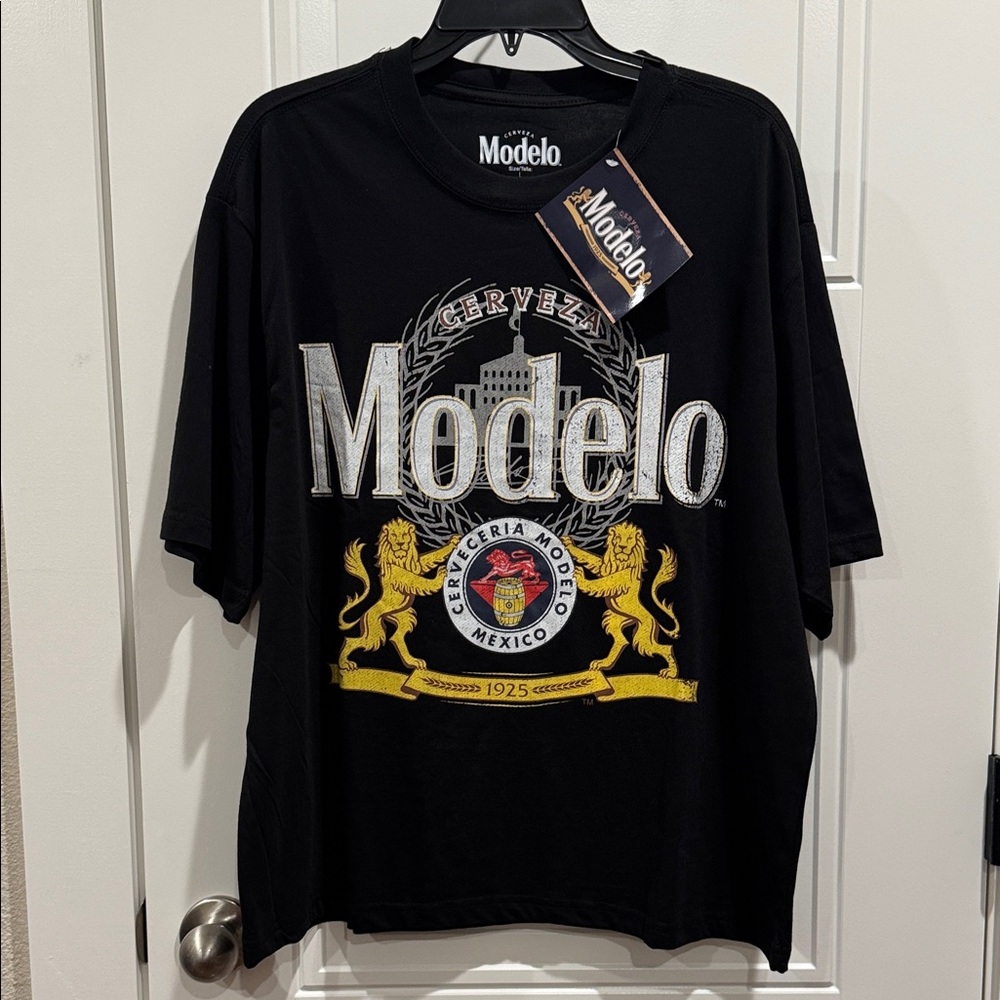Modelo Black Tee with Gold and White Crest